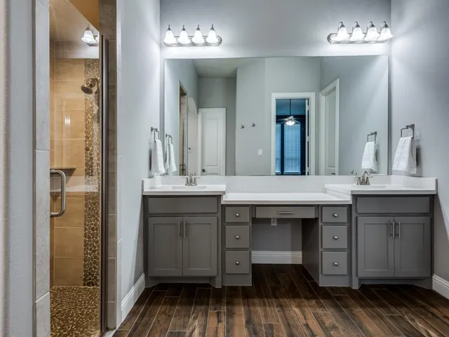 a bathroom with a sink and a mirror