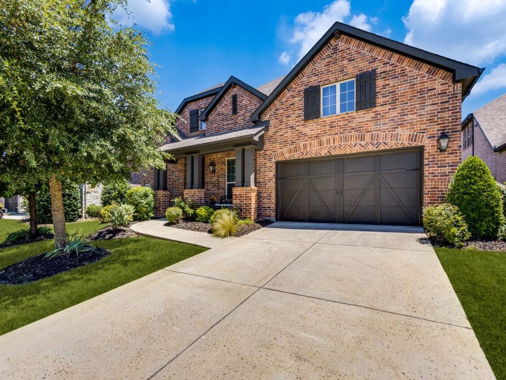 3422 Secretariat Place Celina, TX 75009 - Photo 2 of 28 a front view of a house with garden