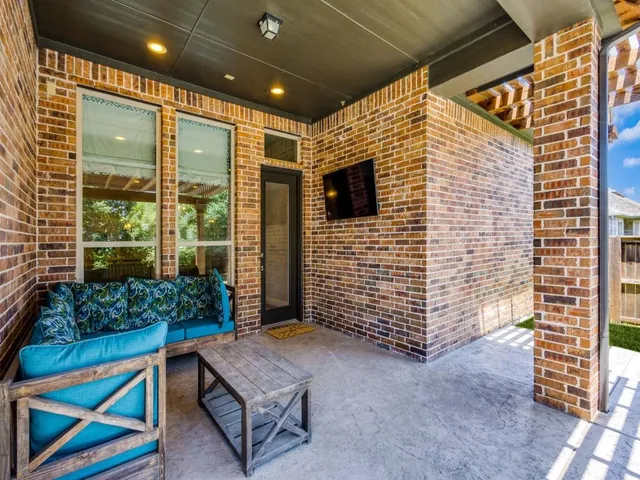 a view of house with outdoor space and sitting area