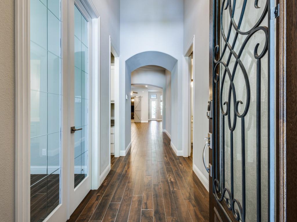 3422 Secretariat Place Celina, TX 75009 - Photo 4 of 28 a view of a hallway with wooden floor and stairs