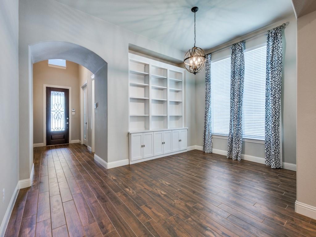 3422 Secretariat Place Celina, TX 75009 - Photo 5 of 28 a view of a room with wooden floor staircase and windows
