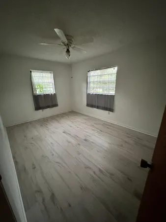 an empty room with a empty space and window