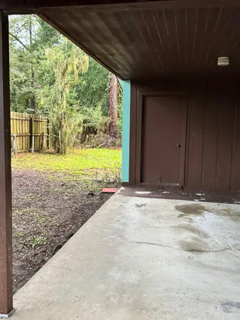 a backyard of a house with lots of green space