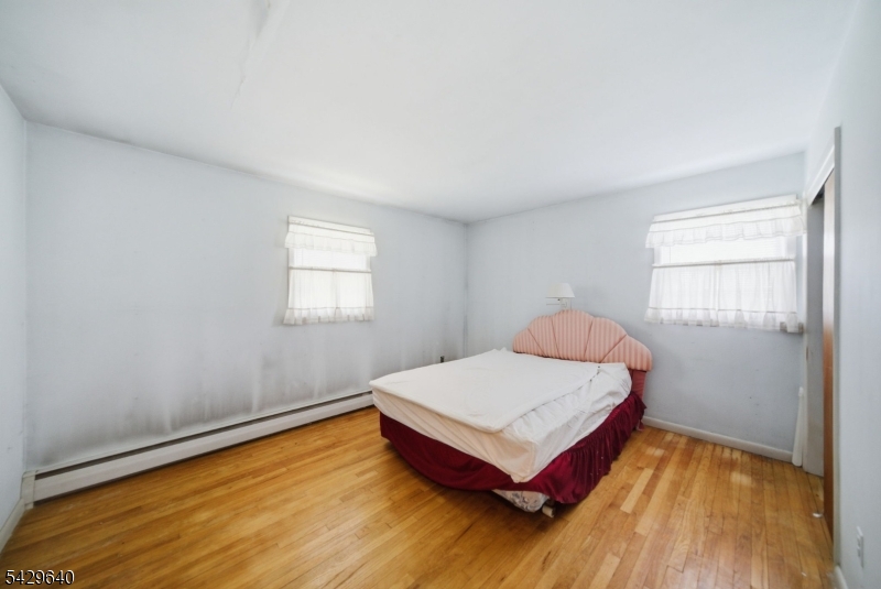 49 Heather Hills Drive Oak Ridge, NJ 07438 - Photo 20 of 34 a room with a bed and window
