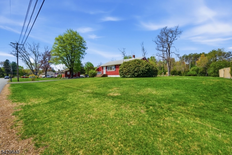 49 Heather Hills Drive Oak Ridge, NJ 07438 - Photo 3 of 34 a view of a field of grass and trees
