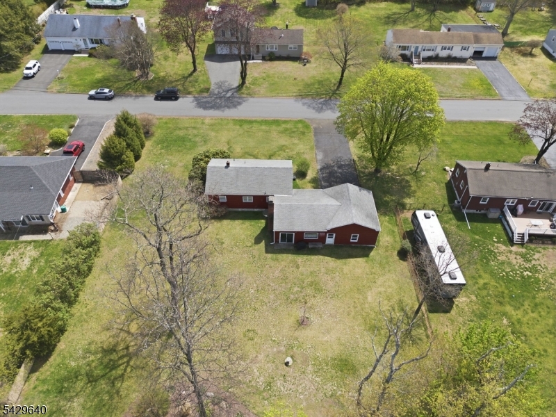 49 Heather Hills Drive Oak Ridge, NJ 07438 - Photo 31 of 34 an aerial view of a house with yard swimming pool and outdoor seating