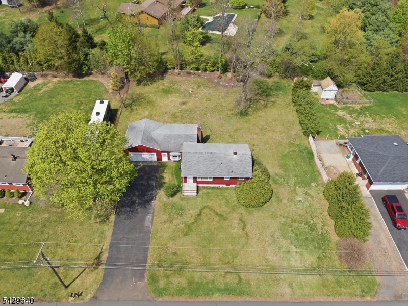 49 Heather Hills Drive Oak Ridge, NJ 07438 - Photo 32 of 34 an aerial view of a house with a yard