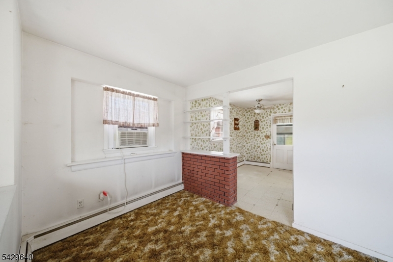 49 Heather Hills Drive Oak Ridge, NJ 07438 - Photo 5 of 34 a view of room with window and cabinet