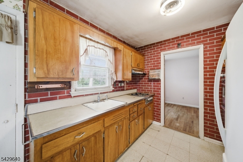 49 Heather Hills Drive Oak Ridge, NJ 07438 - Photo 6 of 34 a kitchen with a sink and a window