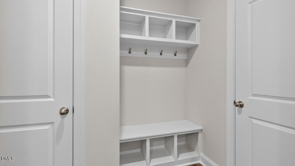 2204 Warbler Drive Apex, NC 27539 - Photo 14 of 32 a room with a white cabinet and a white door