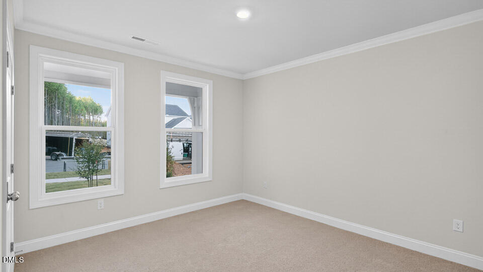 2204 Warbler Drive Apex, NC 27539 - Photo 21 of 32 an empty room with a window
