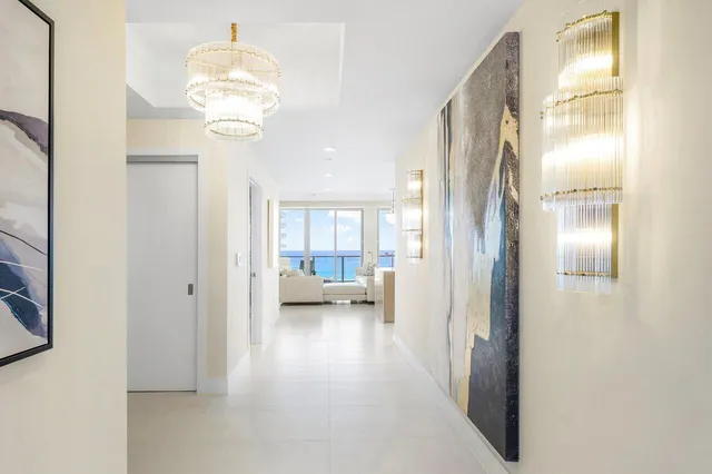 a bedroom with a large window and a flat screen tv