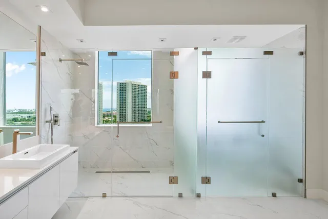 a view of a balcony with a dining table and chairs