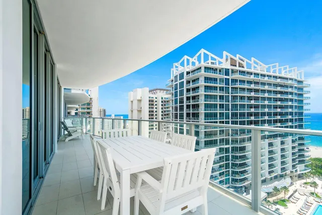 a bathroom with a sink and mirror with toilet