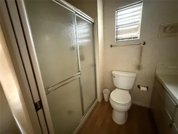 a living room with furniture and painting on the wall