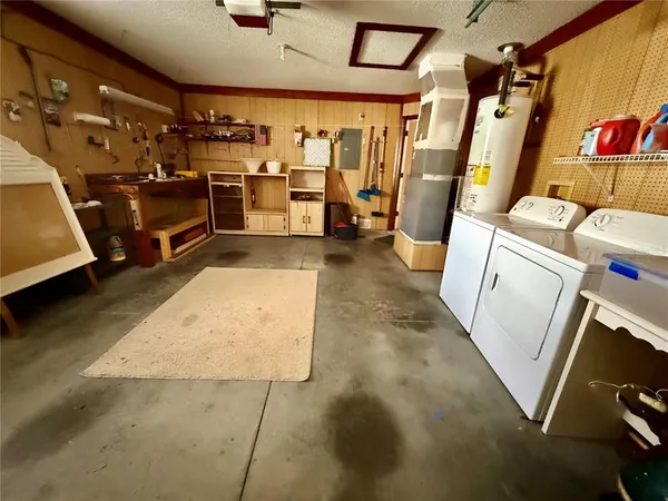 a hallway with wooden floor and stairs