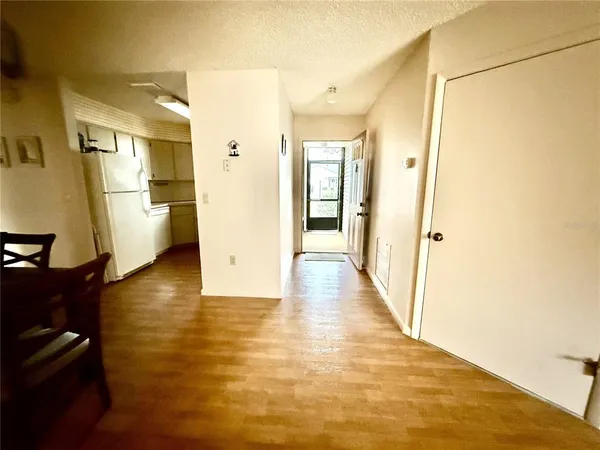a kitchen with a sink a refrigerator a stove top oven and cabinets