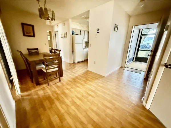 a bedroom with a bed and a flat tv screen on dresser