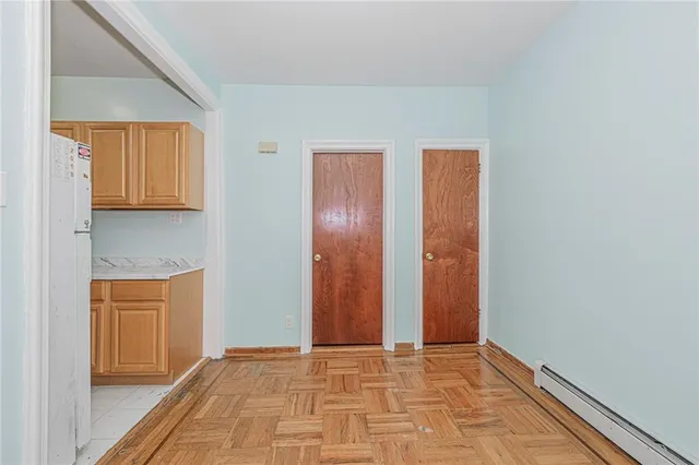 a view of kitchen with refrigerator sink and stove