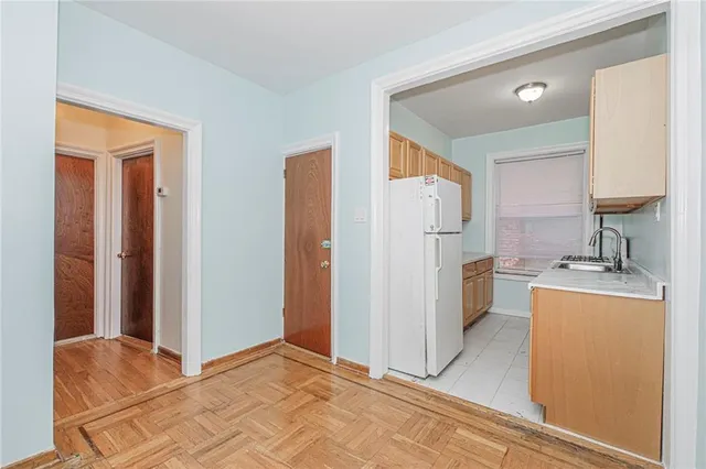 a kitchen with stainless steel appliances granite countertop a sink and cabinets