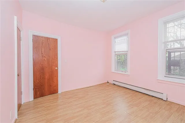 a white toilet sitting next to a bath tub