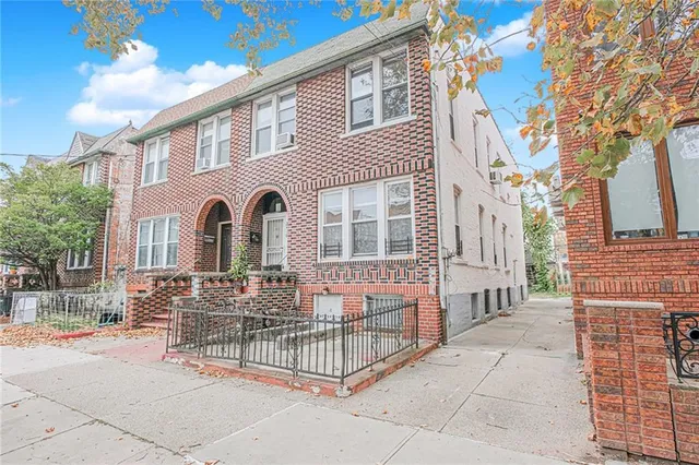 a front view of a house with garage