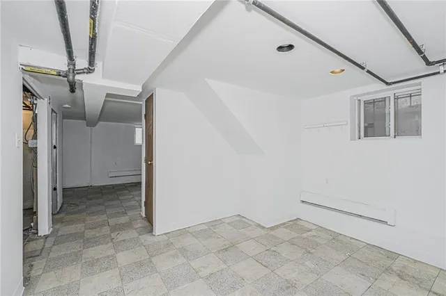 a bathroom with a sink a toilet and a window