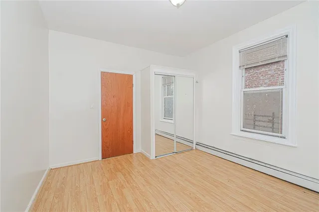 a view of kitchen with sink and refrigerator
