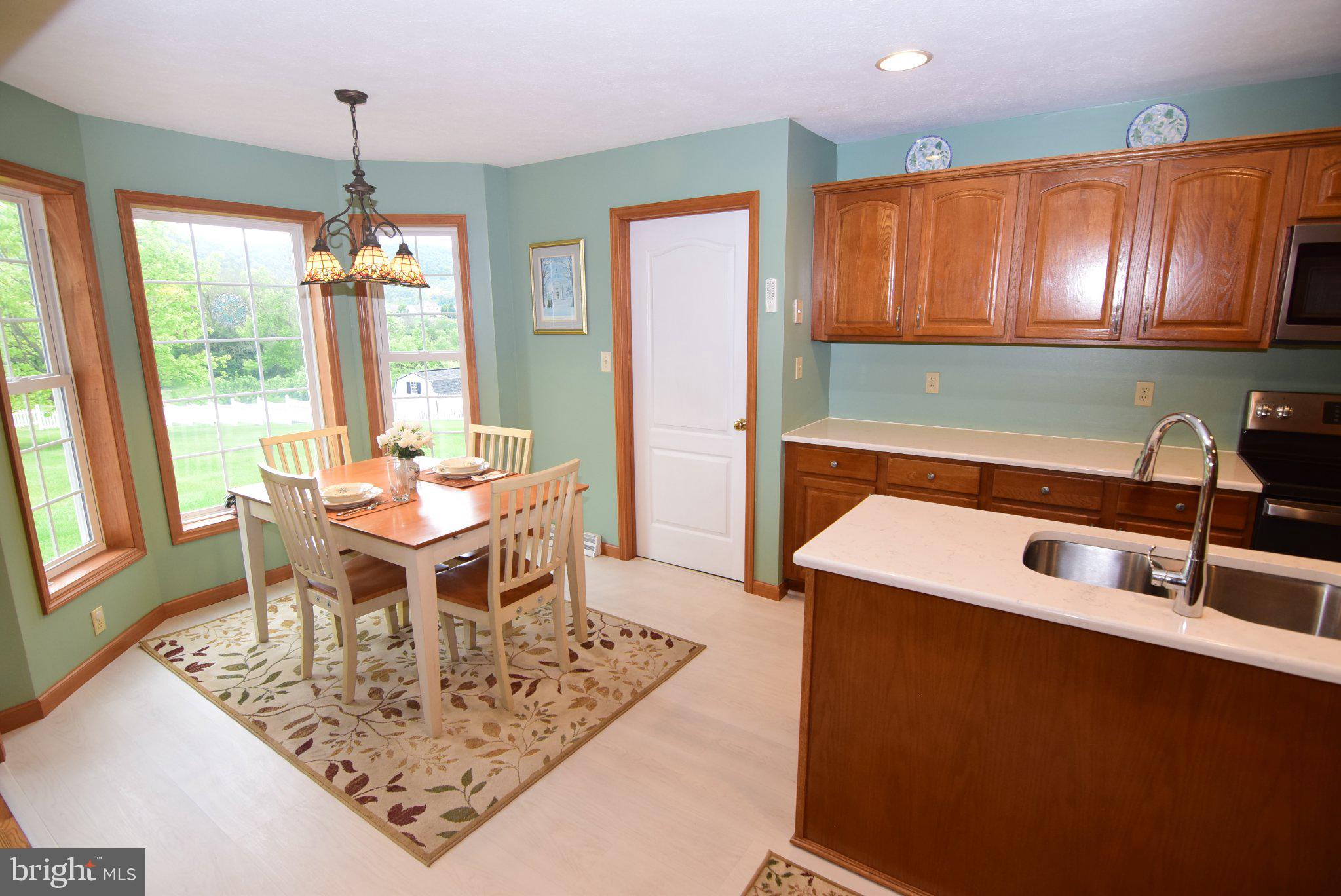 470 Millgate Road Bellefonte, PA 16823 - Photo 20 of 63 a dining room with furniture a window and a chandelier