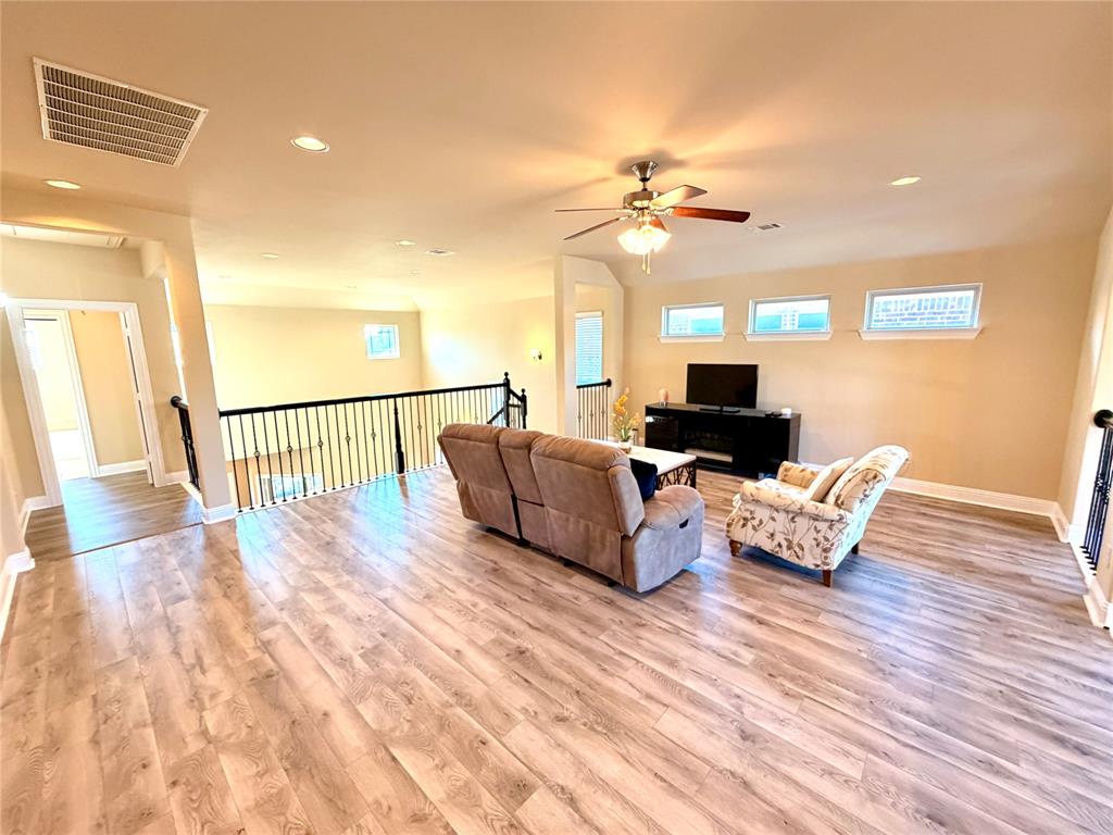 2403 Rosemary Lane Rowlett, TX 75089 - Photo 10 of 20 a view of a livingroom with furniture nad wooden floor