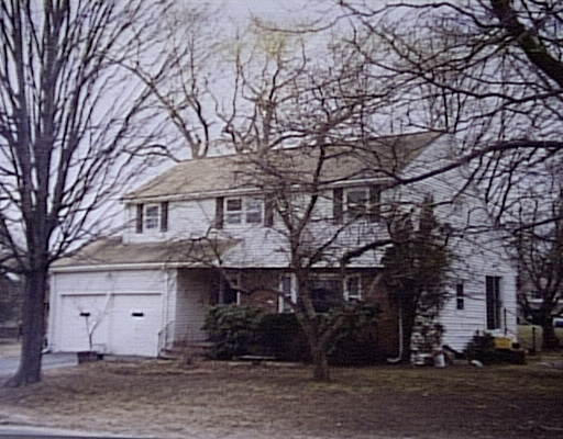 16 Lillian Road Lexington, MA 02420 - Photo 1 of 1 a front view of a house with a tree