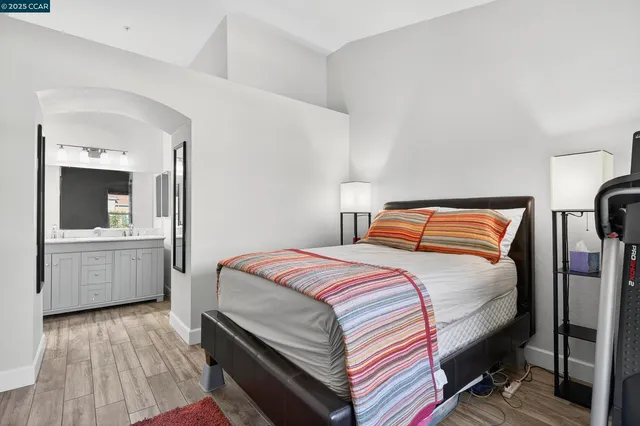 a bedroom with a bed and a view of bathroom