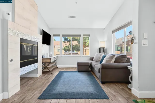 a living room with furniture and a large window