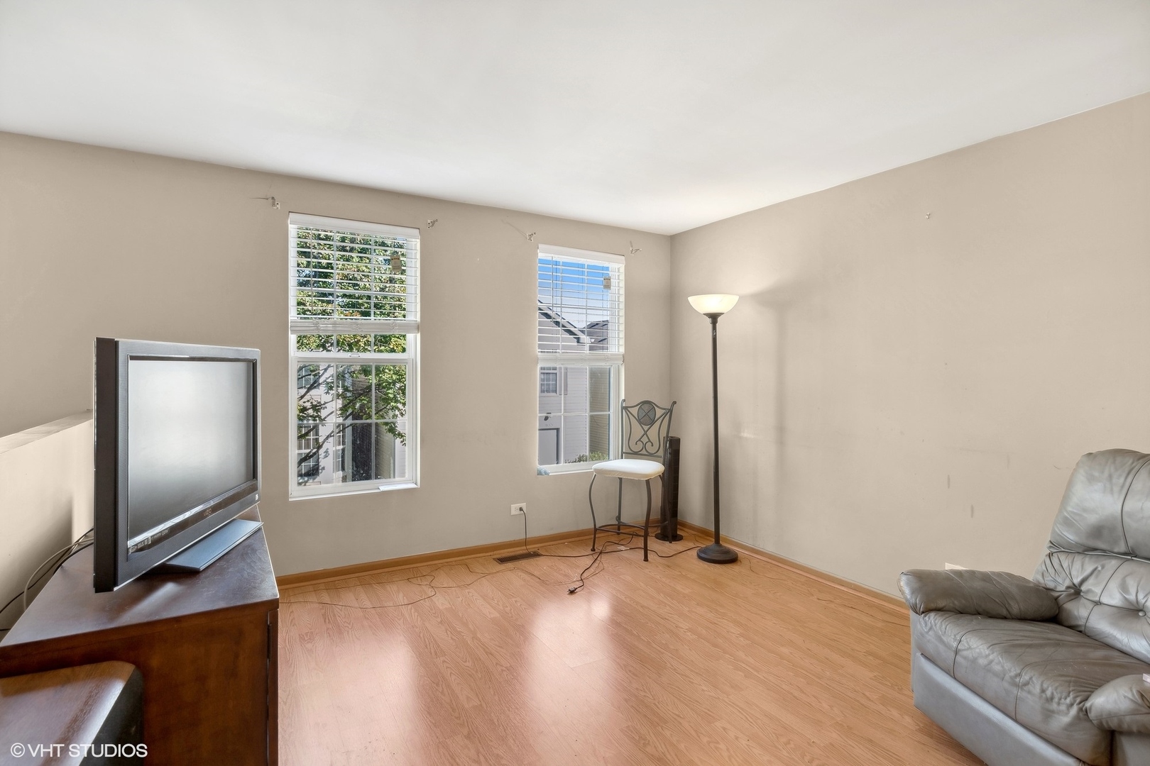 657 Serendipity Drive Aurora, IL 60504 - Photo 9 of 13 a living room with furniture and a flat screen tv