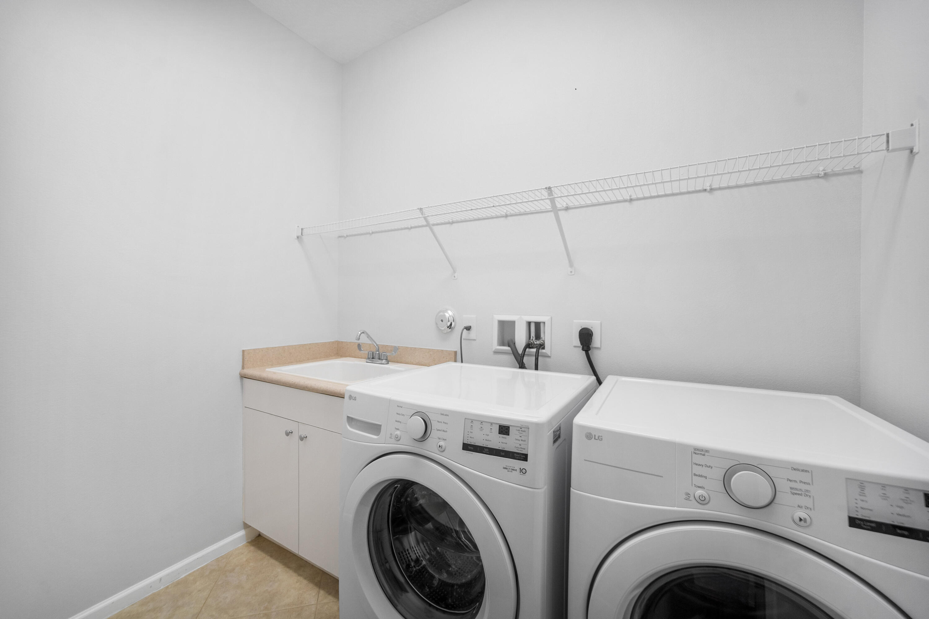 1430 Northwest 48th Lane Boca Raton, FL 33431 - Photo 15 of 54 a view of storage and utility room with washer and dryer