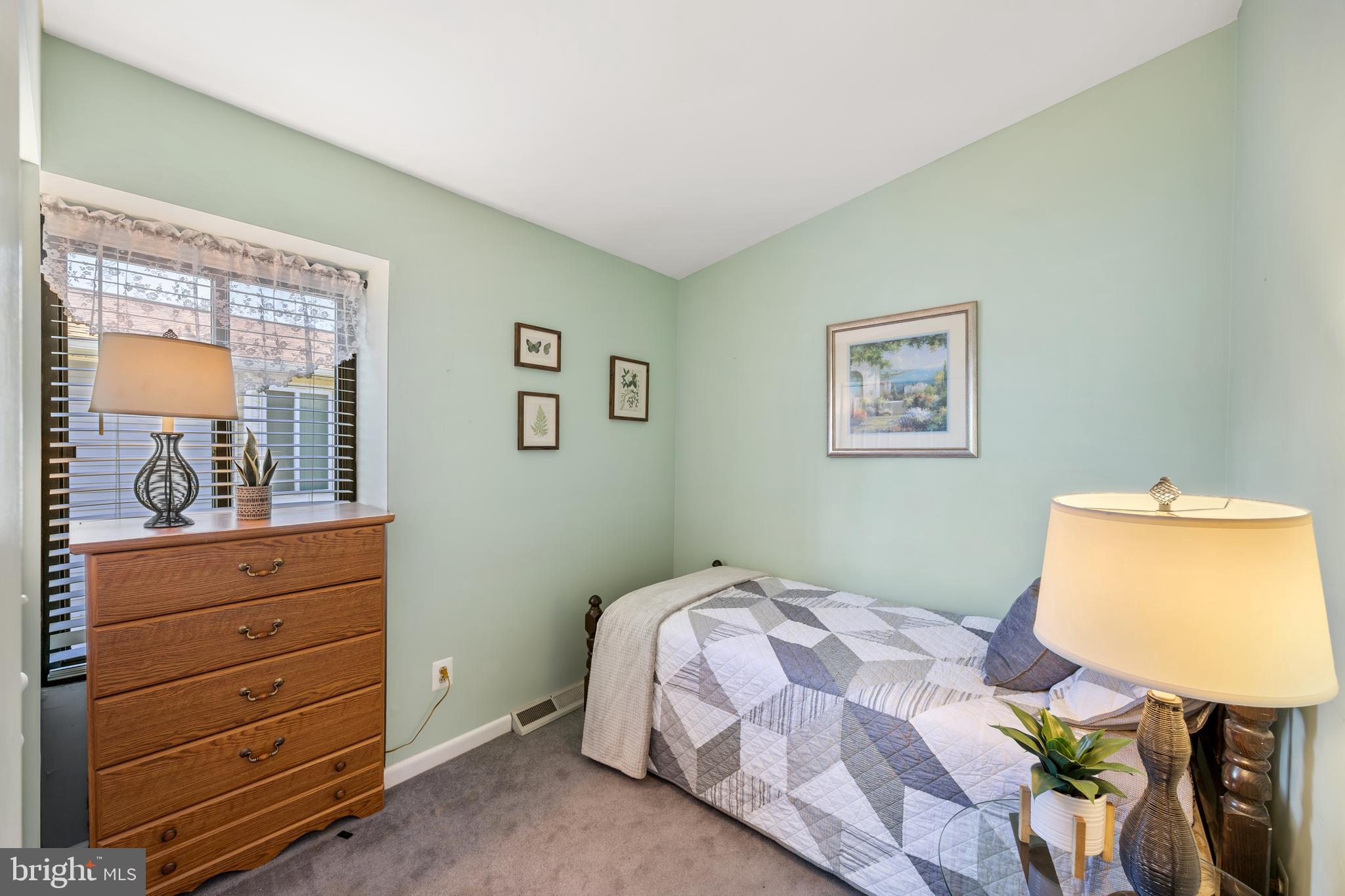 802 Waterview Drive Curtis Bay, MD 21226 - Photo 40 of 70 serene bedroom features calming sage-green walls.