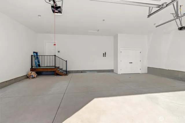 a view of room with stairs and a chandelier
