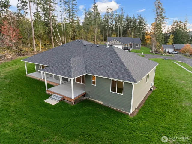 a aerial view of a house with a yard