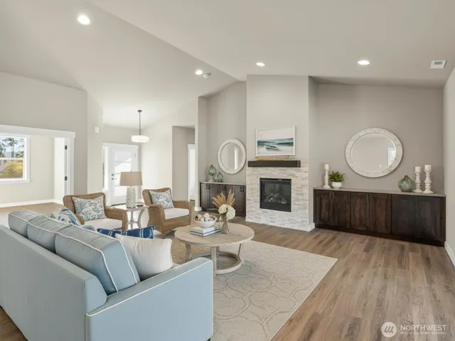a living room with furniture a window and a fireplace