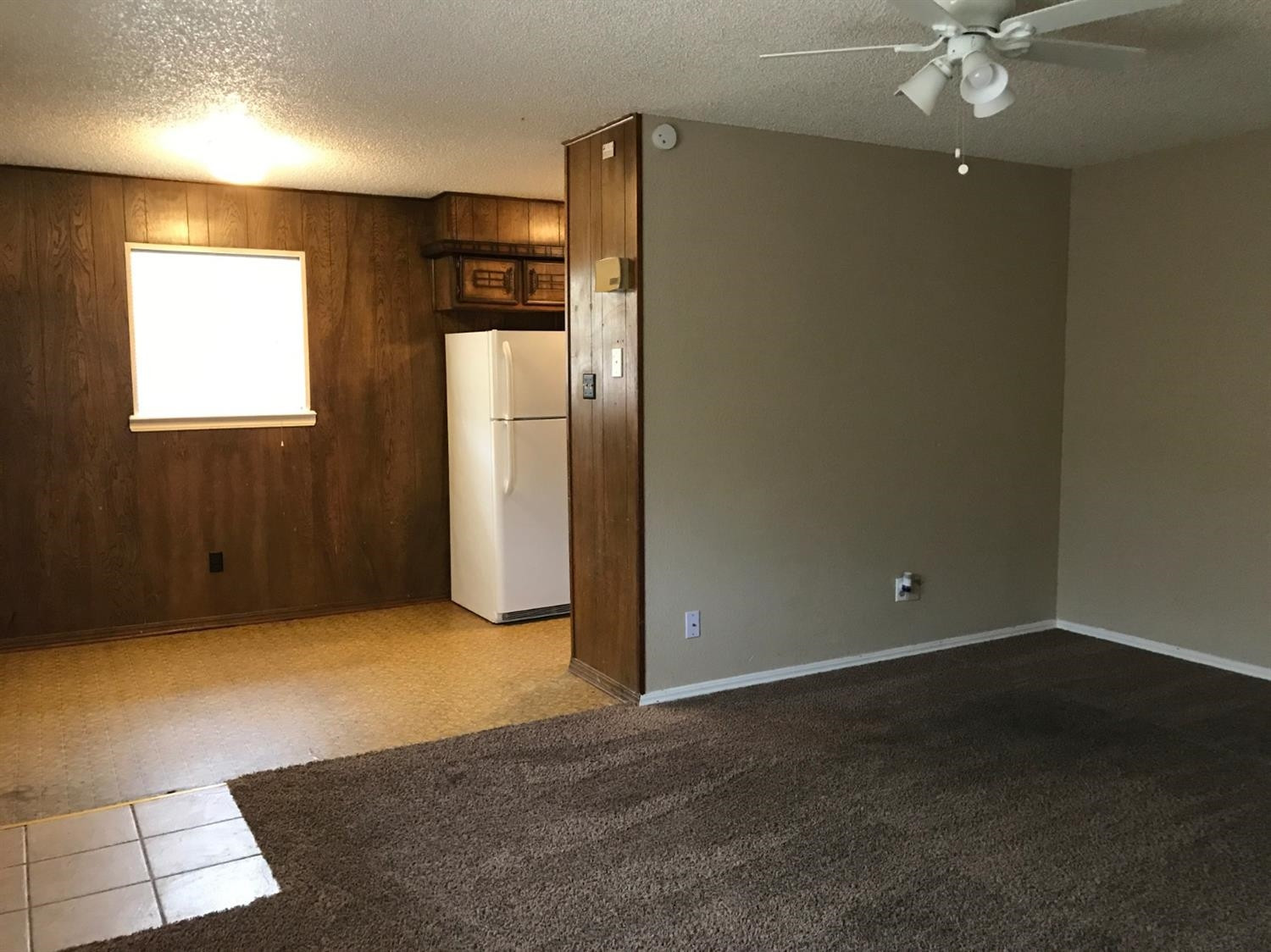 1608 59th Street, Unit 3 Lubbock, TX 79412 - Photo 2 of 8 an empty room with a empty space and windows