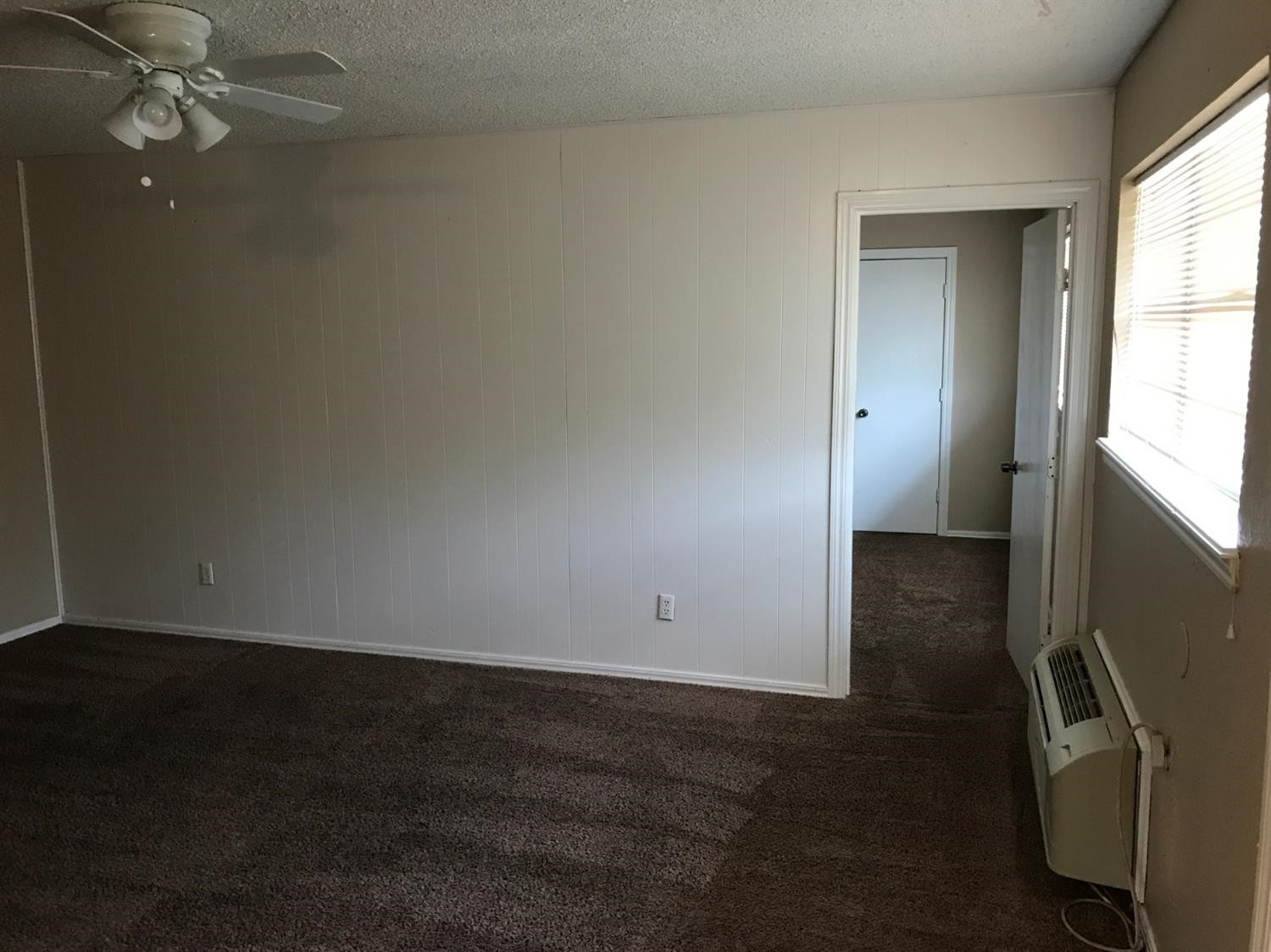 1608 59th Street, Unit 3 Lubbock, TX 79412 - Photo 3 of 8 wooden floor in an empty room
