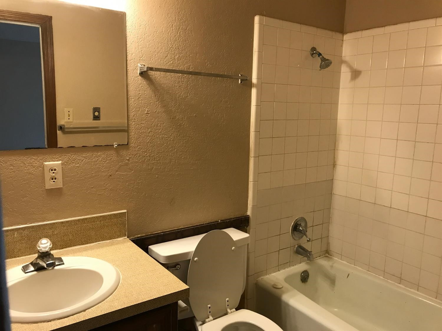 1608 59th Street, Unit 3 Lubbock, TX 79412 - Photo 6 of 8 a bathroom with a sink and a bathtub