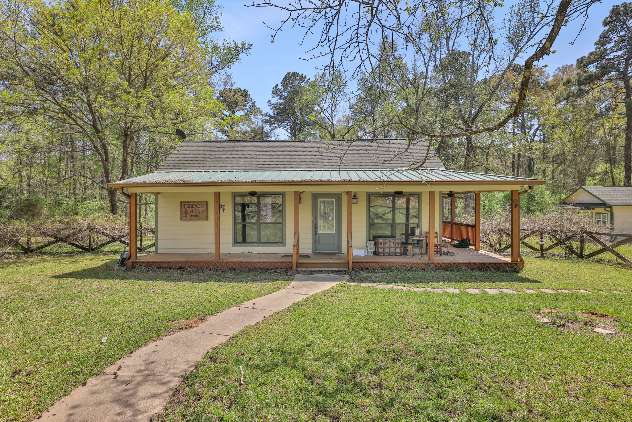 250 Critter Creek Road Coldspring, TX 77331 - Photo 27 of 48 Cabin 1 - 2040 SF with wrap around porch. 1-2 bedrooms, 2 full bathrooms.