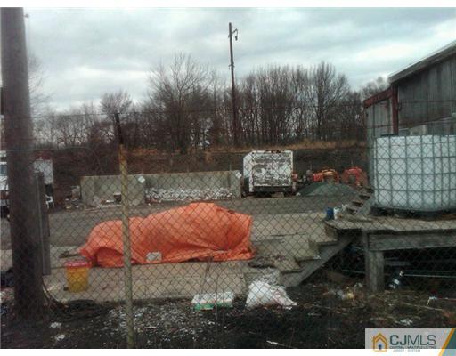 555 Old Water Works Road Old Bridge, NJ 08857 - Photo 5 of 12 a backyard of a house with table and chairs