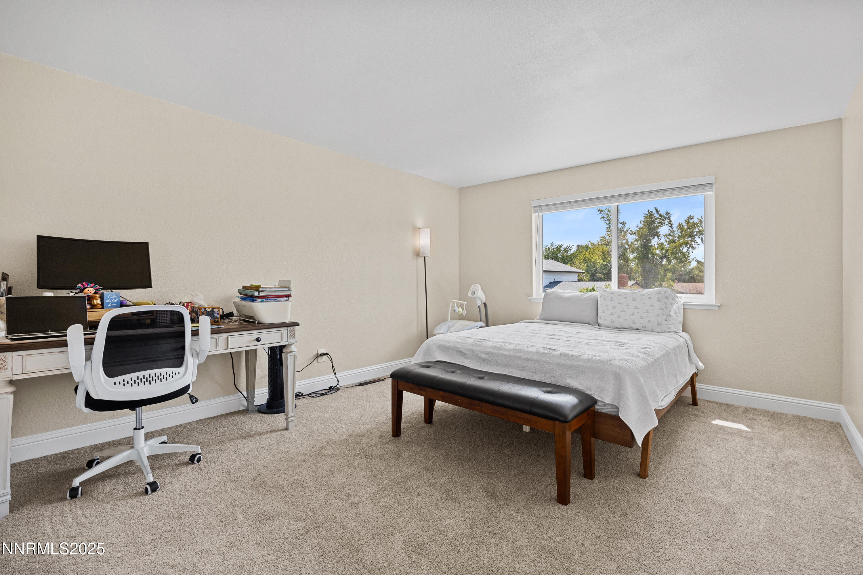 2138 Rizzo Drive Sparks, NV 89434 - Photo 15 of 24 a bedroom with a bed a computer on the desk and chair