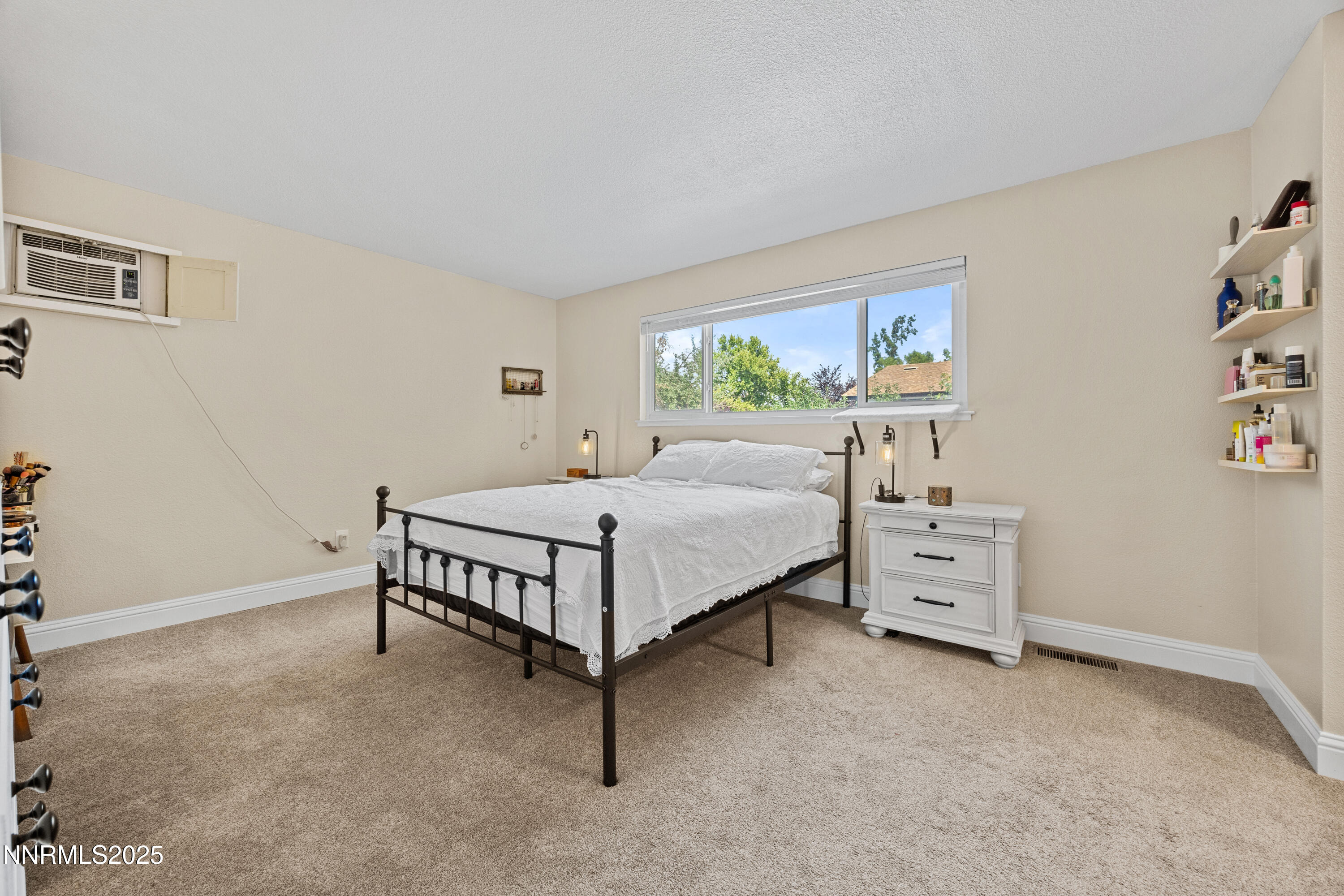 2138 Rizzo Drive Sparks, NV 89434 - Photo 17 of 24 a bedroom with a bed and a table