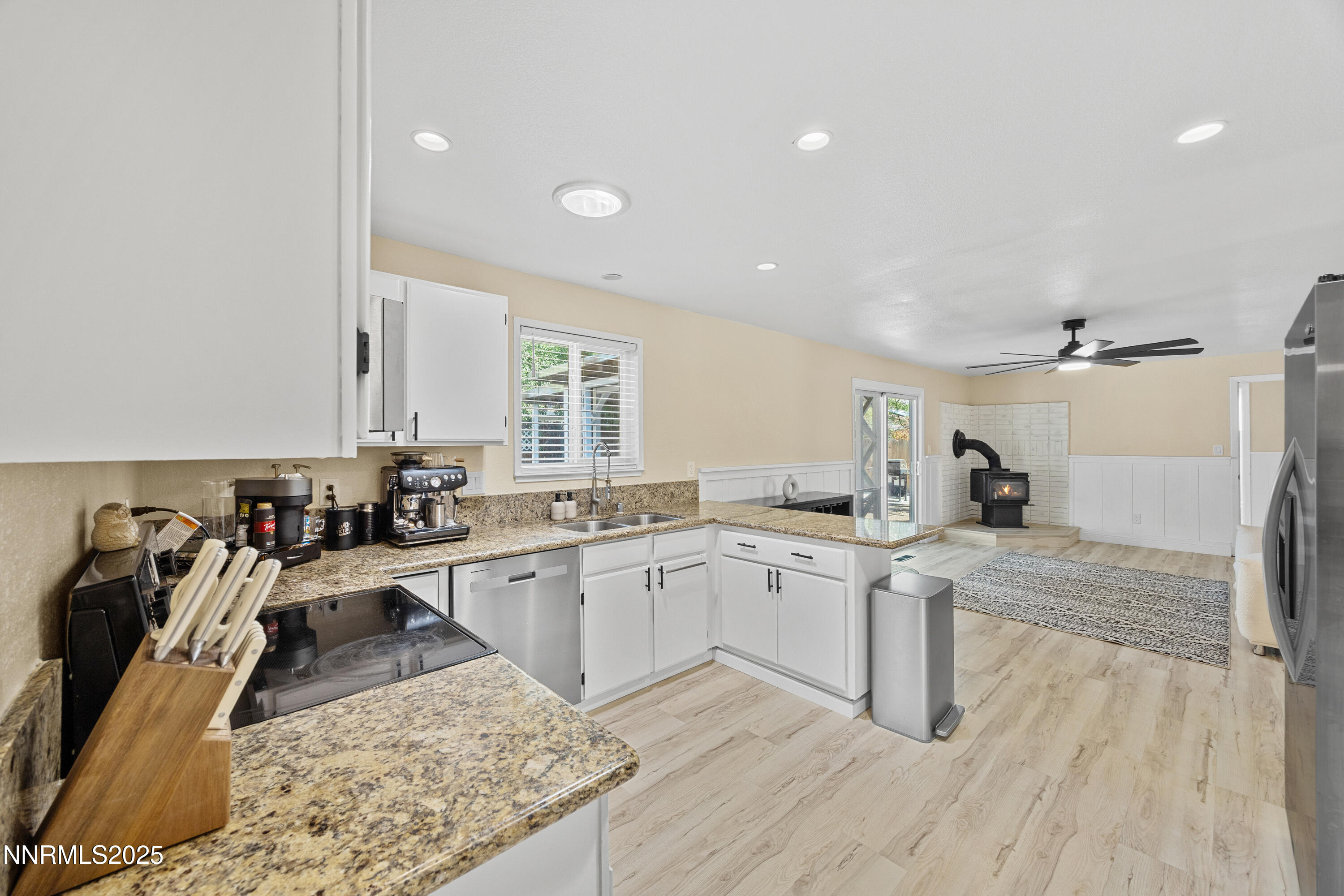 2138 Rizzo Drive Sparks, NV 89434 - Photo 7 of 24 a kitchen with a sink a stove and cabinets