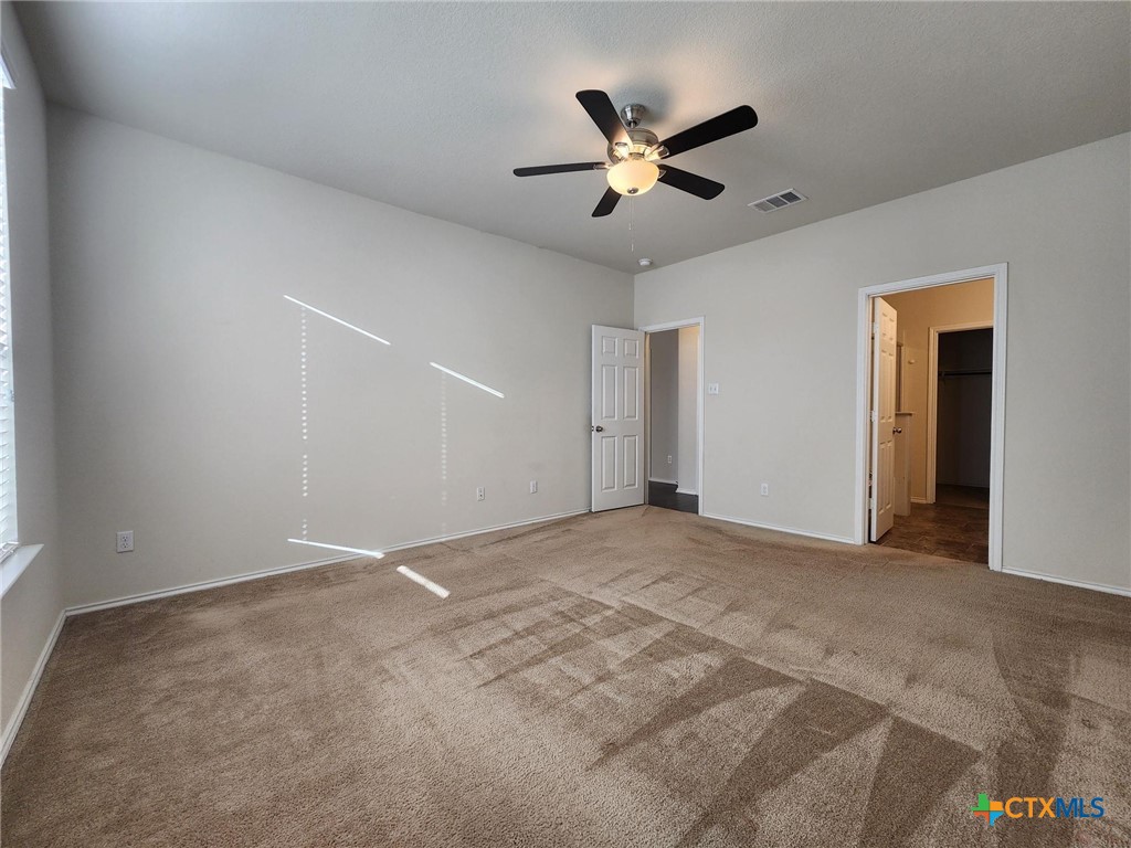 5822 Hopkins Drive Temple, TX 76502 - Photo 21 of 32 a view of an empty room with chandelier fan