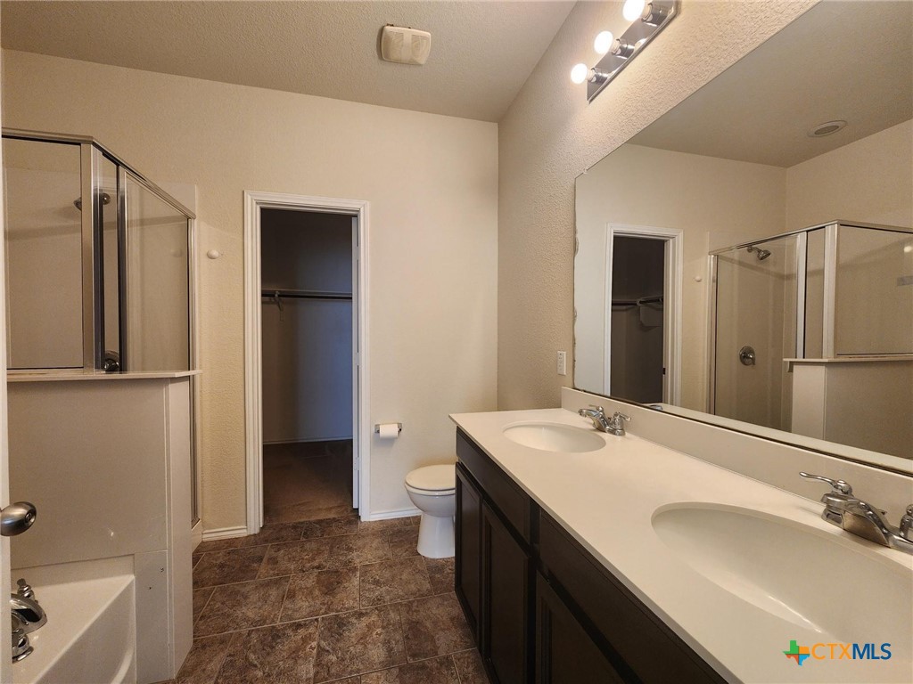 5822 Hopkins Drive Temple, TX 76502 - Photo 22 of 32 a bathroom with a sink a toilet and shower