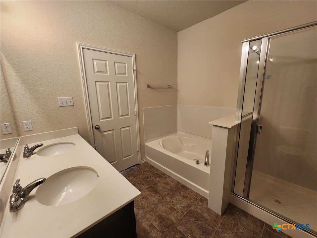 5822 Hopkins Drive Temple, TX 76502 - Photo 24 of 32 a bathroom with a sink a toilet and shower